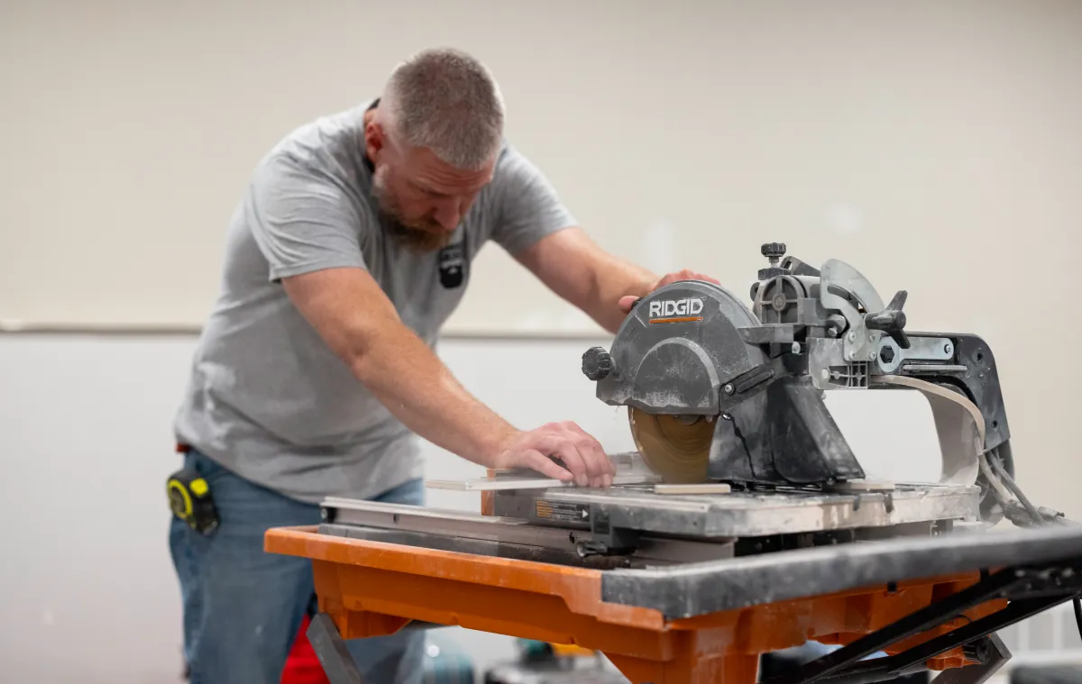 A man using a table saw